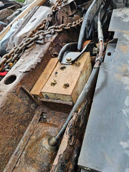Wood block bolted to flatbed frame